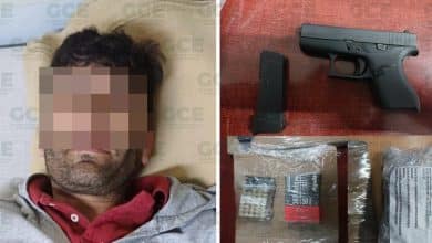 detienen a presunto con arma, cartucho y dinero